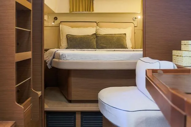 Slide: The Image of Interior of 2018 Lagoon 40 catamaran featuring cozy bedroom with double bed and wooden furnishings. - 51