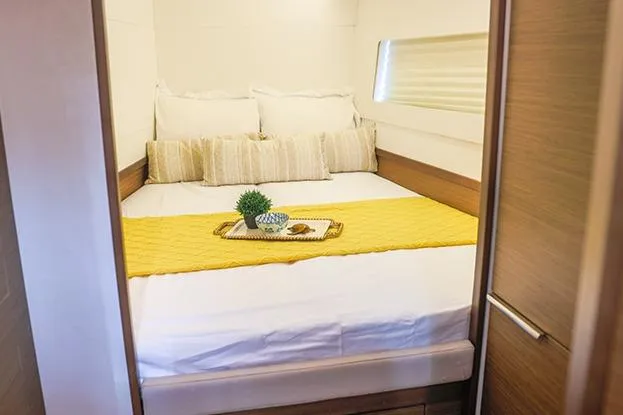 Slide: The Image of Cozy bedroom in 2018 Lagoon 40 yacht with stylish decor and natural light. - 53