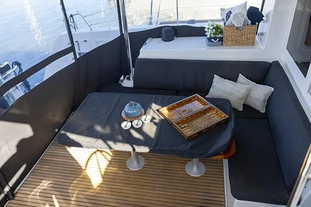 Slide: The Image of 2018 Lagoon 40 yacht interior with cozy seating and elegant decor. - 64