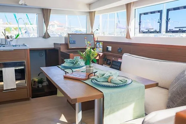 Slide: The Image of Interior of 2018 Lagoon 40 catamaran with elegant dining setup and modern design. - 69