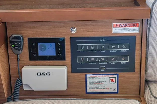 Slide: The Image of Control panel of a 2018 Lagoon 40 catamaran with navigation and communication equipment. - 72