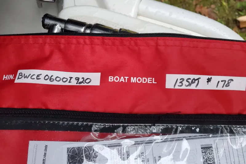 Slide: The Image of Red bag with Boston Whaler 130 Super Sport 2020 model details and HIN label. - 11