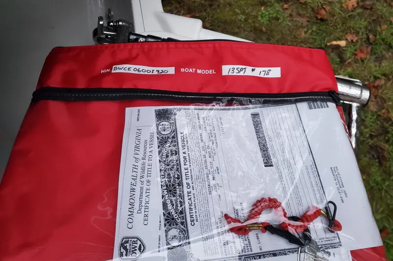 Slide: The Image of Red bag with boat documents and keys for 2020 Boston Whaler 130 Super Sport. - 12