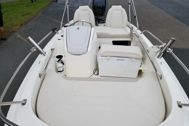 Slide: The Image of 2020 Boston Whaler 130 Super Sport boat interior with seating and storage. - 6