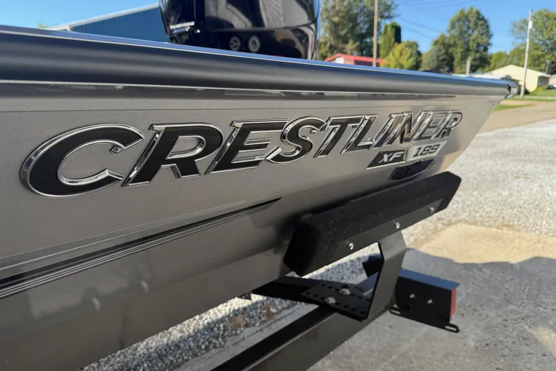 Slide: The Image of 2026 Crestliner XF189 boat on trailer, close-up of logo and model name. - 15