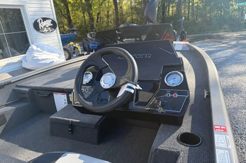 Slide: The Image of 2026 Crestliner XF189 boat dashboard with steering wheel and gauges in outdoor setting. - 6