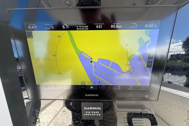 Slide: The Image of Garmin navigation display on 2022 Cobia 280 Center Console boat, showing map and data. - 34