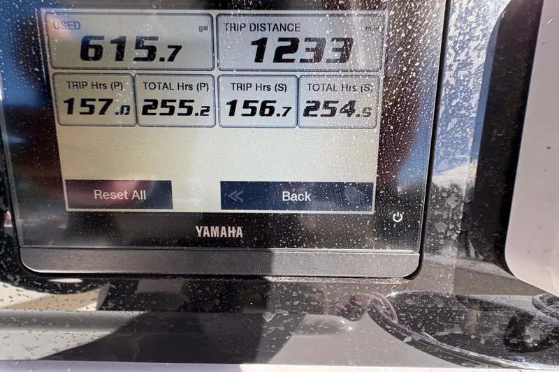 Slide: The Image of Yamaha display showing fuel usage and trip data on Cobia 280 Center Console, 2022 model. - 36
