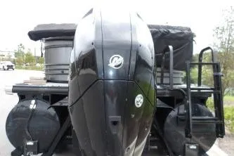 Slide: The Image of 2021 Regency 250 LE3 Sport boat with powerful outboard motor, rear view. - 4