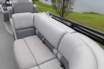 Slide: The Image of 2021 Regency 250 LE3 Sport boat with luxurious gray seating by the water. - 7