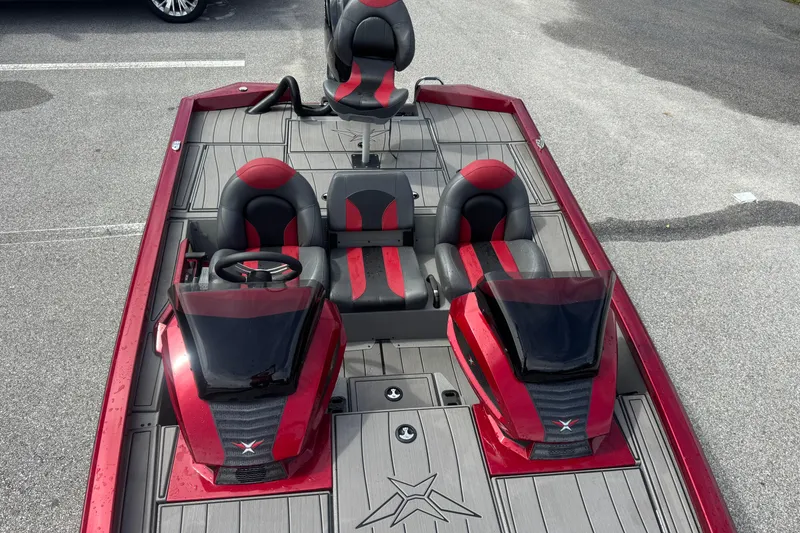 Slide: The Image of 2022 Vexus AVX1880 boat with red and black seating, dual consoles, and sleek design. - 14