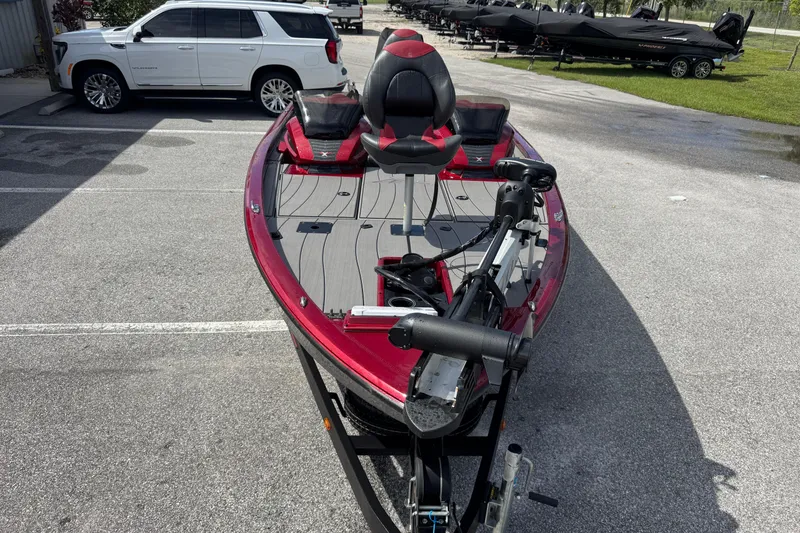 Slide: The Image of 2022 Vexus AVX1880 boat in parking lot, red and gray design, with trailer. - 4