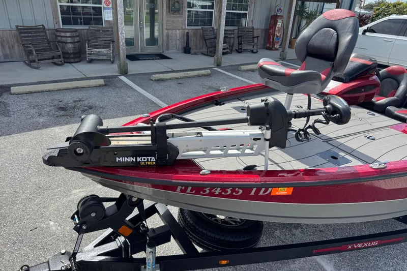 Slide: The Image of 2022 Vexus AVX1880 boat with Minn Kota Ultrex motor in parking lot. - 5