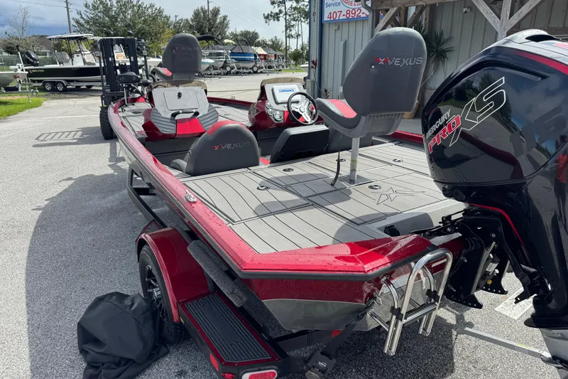 Slide: The Image of 2022 Vexus AVX1880 boat with Mercury Pro XS engine, parked outdoors. - 8