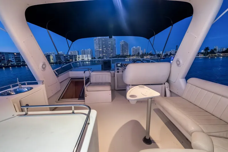 Slide: The Image of Luxurious 2003 Navigator Rival 5700 yacht interior with city skyline view at dusk. - 25