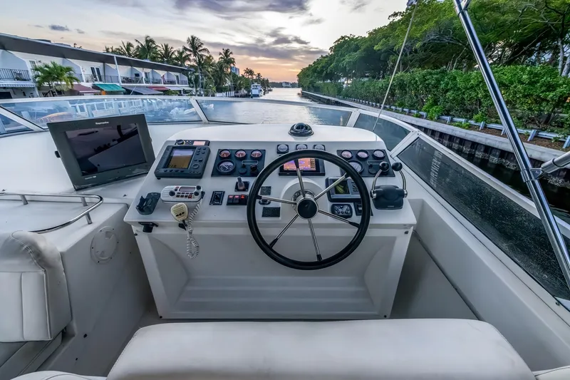 Slide: The Image of Cockpit of 2003 Navigator Rival 5700 yacht with steering wheel and navigation equipment. - 31