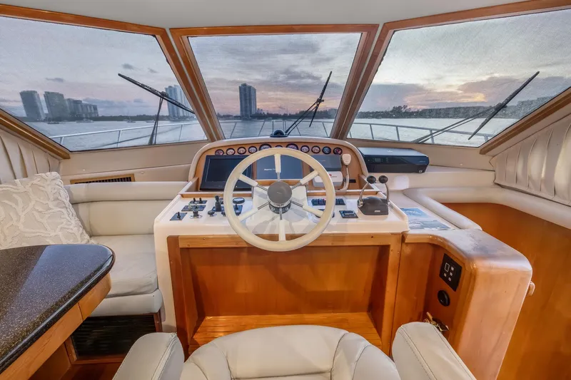 Slide: The Image of 2003 Navigator Rival 5700 yacht helm with panoramic view at sunset. - 32