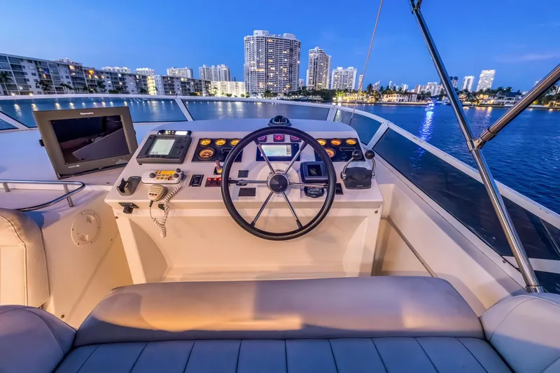 Slide: The Image of Cockpit of 2003 Navigator Rival 5700 yacht with city skyline at dusk. - 33