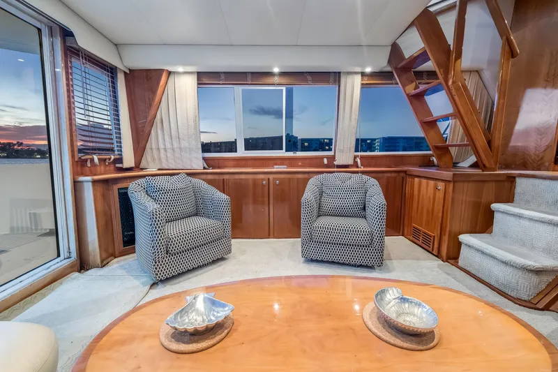 Slide: The Image of Luxurious 2003 Navigator Rival 5700 yacht interior with elegant seating and wooden accents. - 40