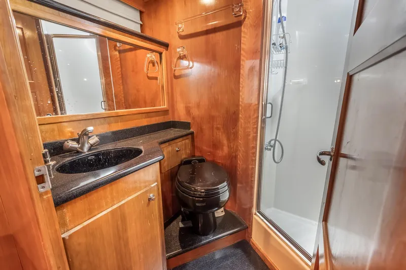 Slide: The Image of Luxurious 2003 Navigator Rival 5700 yacht bathroom with wood accents and modern fixtures. - 45