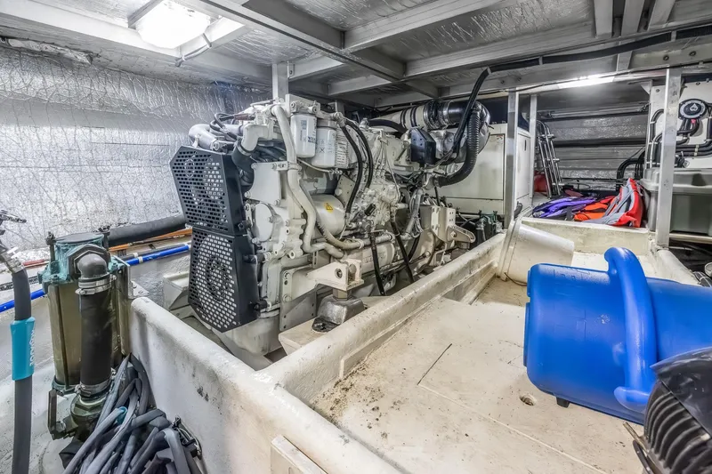 Slide: The Image of Engine room of 2003 Navigator Rival 5700 yacht with visible machinery and equipment. - 51