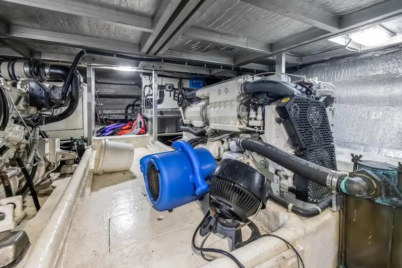 Slide: The Image of Engine room of 2003 Navigator Rival 5700 yacht, showcasing machinery and equipment. - 52