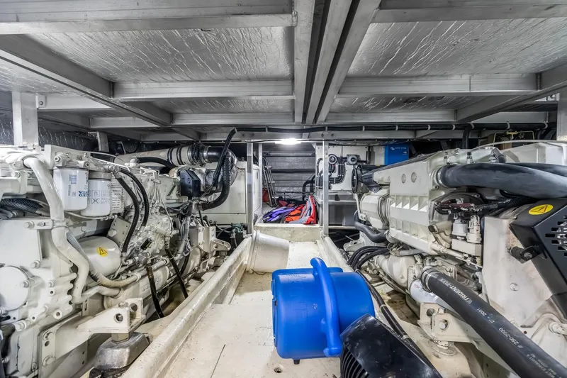 Slide: The Image of Engine room of 2003 Navigator Rival 5700 yacht with visible machinery and equipment. - 53