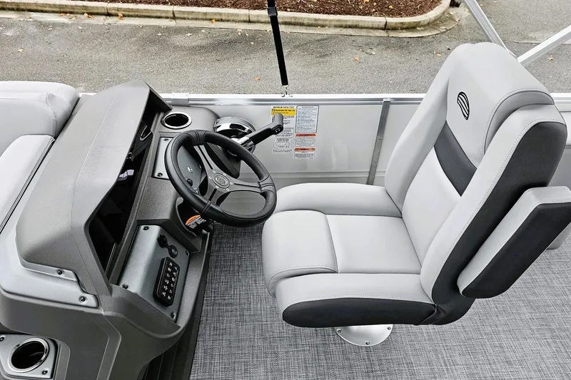 Slide: The Image of 2026 Sun Tracker Party Barge 22 RF XP3 interior with gray seating and cup holders. - 10