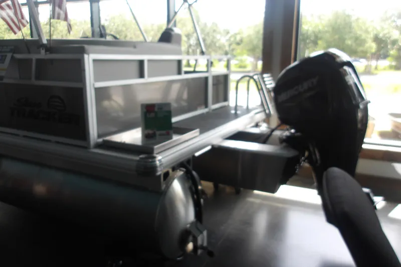 Slide: The Image of 2026 Sun Tracker Bass Buggy 16 XL Select pontoon boat with Mercury outboard motor. - 18