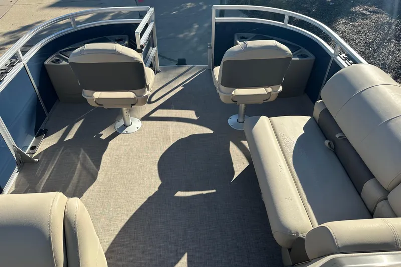 Slide: The Image of 2025 Sun Tracker Fishin' Barge 20 DLX interior with seating and deck view. - 3