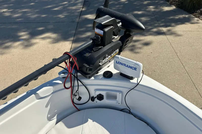 Slide: The Image of 2024 Tahoe 185 S boat with Minn Kota trolling motor and Lowrance fish finder. - 3