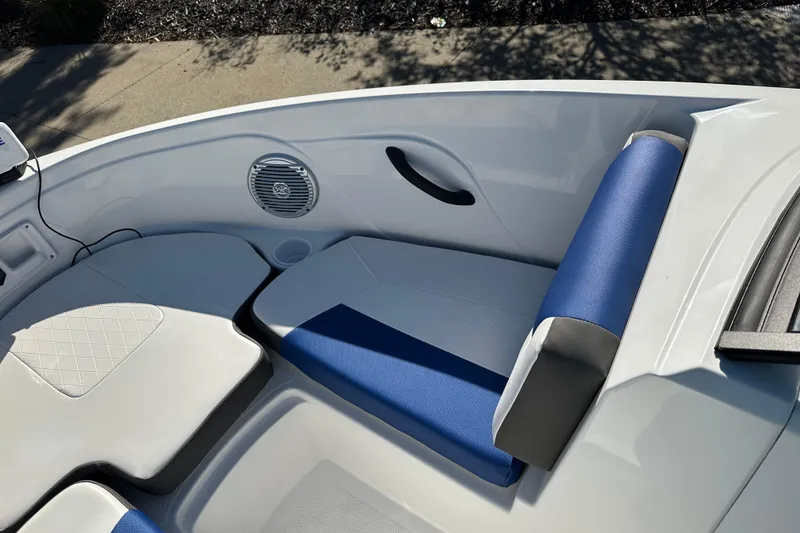 Slide: The Image of 2024 Tahoe 185 S boat interior with blue and white seating, speaker, and handle. - 5