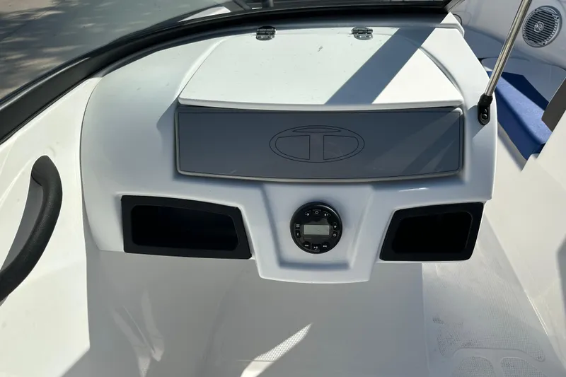Slide: The Image of 2024 Tahoe 185 S boat dashboard with control panel and speaker. - 6