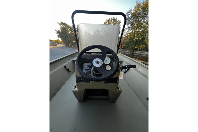 Slide: The Image of Steering console of 2026 Tracker Grizzly 2072 CC boat with gauges and controls. - 5