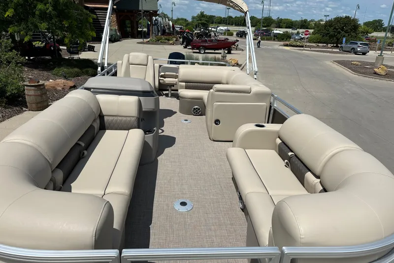 Slide: The Image of 2025 Sun Tracker SportFish 22 DLX pontoon boat with spacious seating and modern design. - 3