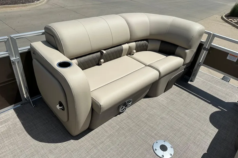 Slide: The Image of Luxurious seating on 2025 Sun Tracker SportFish 22 DLX pontoon boat, featuring cup holder and speaker. - 4
