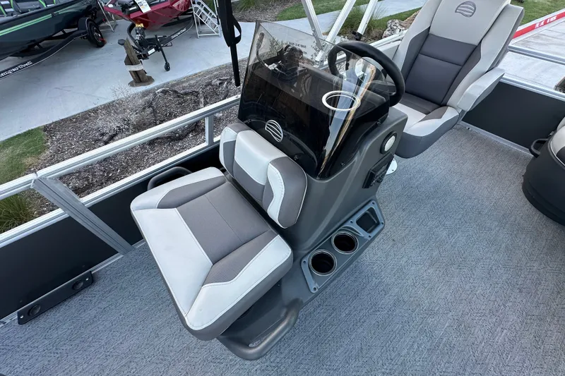 Slide: The Image of 2026 Sun Tracker Bass Buggy 16 XL Select boat interior with steering console and seating. - 20
