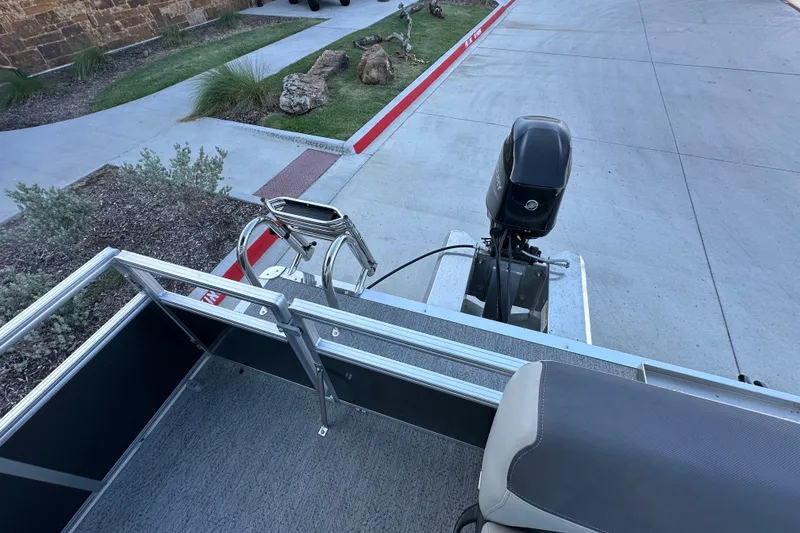 Slide: The Image of 2026 Sun Tracker Bass Buggy 16 XL Select pontoon boat with motor and seating. - 23