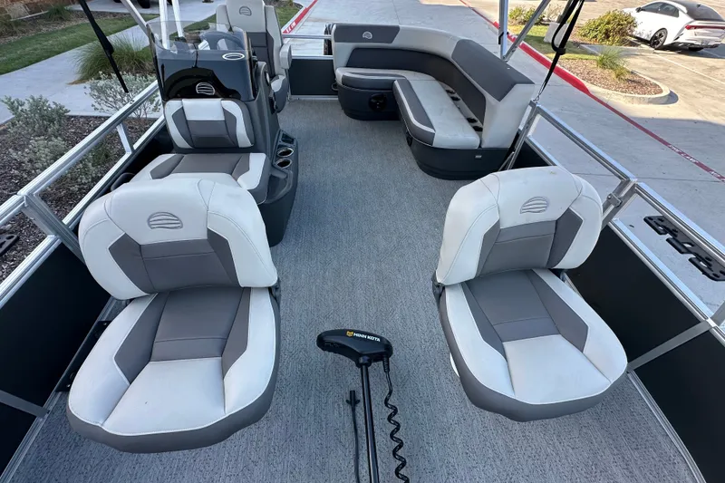 Slide: The Image of 2026 Sun Tracker Bass Buggy 16 XL Select pontoon boat interior with comfortable seating. - 17