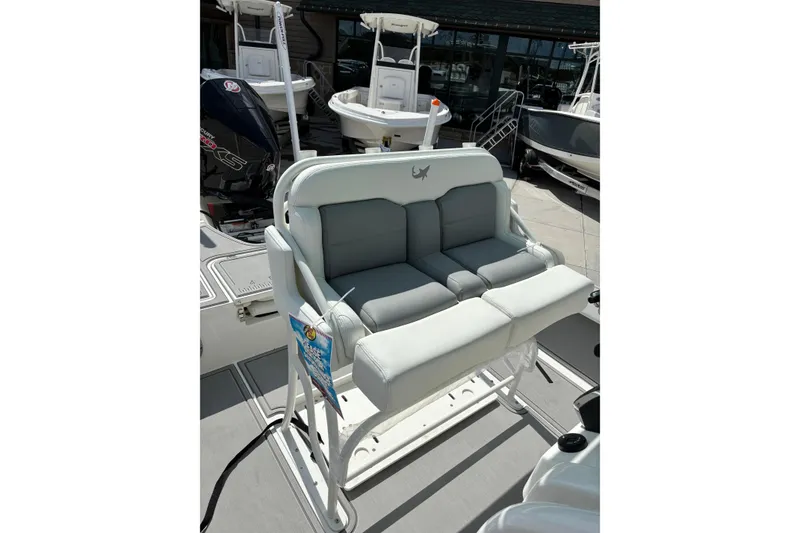 Slide: The Image of 2026 Mako 24 APEX boat seating with dual cushioned seats and sleek design. - 8