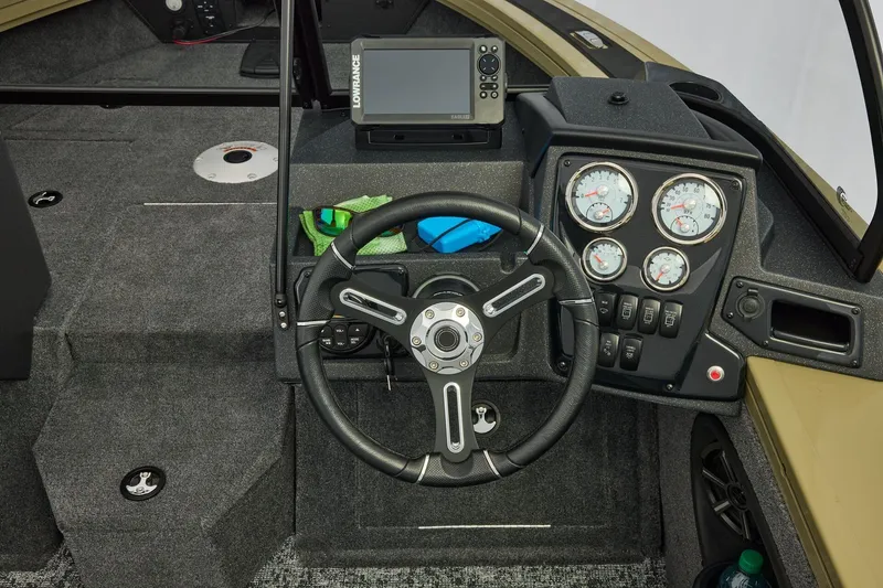 Slide: The Image of 2026 Tracker Targa V-19 Combo boat dashboard with steering wheel and gauges. - 22
