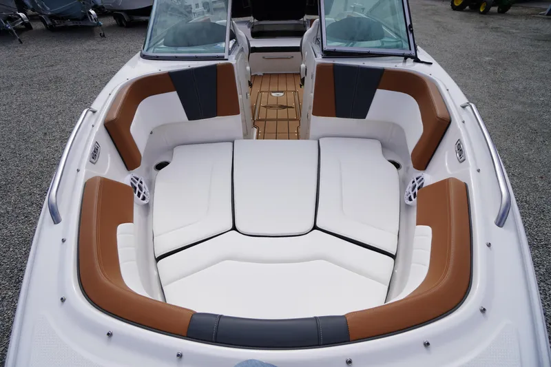 Slide: The Image of 2023 Chaparral 23 SSi OB boat interior with cushioned seating and modern design. - 12