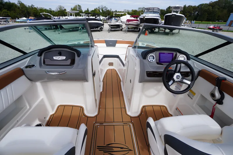 Slide: The Image of 2023 Chaparral 23 SSi OB boat interior with modern dashboard and seating. - 14