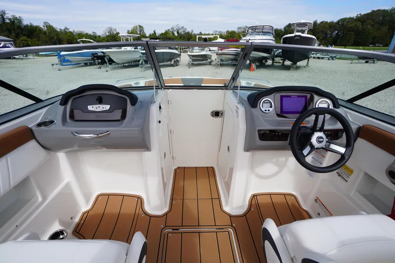 Slide: The Image of 2023 Chaparral 23 SSi OB boat interior with modern dashboard and seating. - 15
