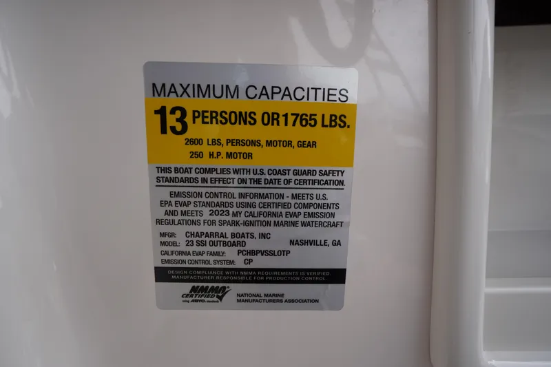 Slide: The Image of 2023 Chaparral 23 SSi OB capacity label: 13 persons or 1765 lbs, 250 HP motor. - 16