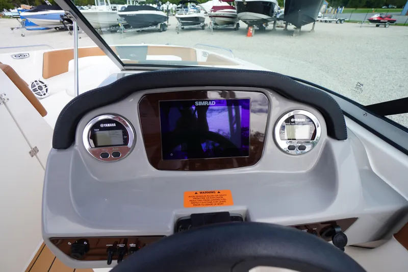 Slide: The Image of 2023 Chaparral 23 SSi OB dashboard with Simrad display and Yamaha gauges. - 20