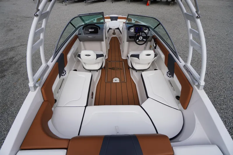 Slide: The Image of 2023 Chaparral 23 SSi OB boat interior with sleek seating and modern dashboard. - 26