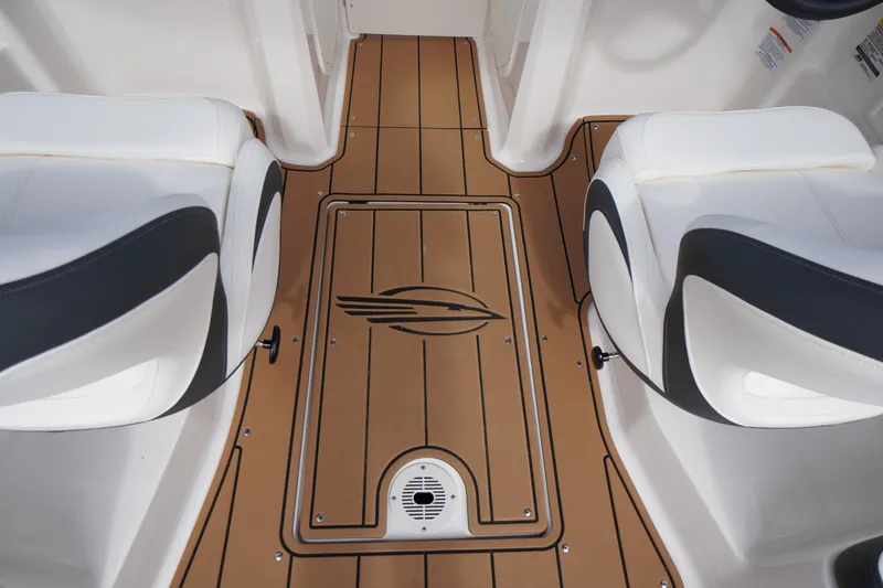 Slide: The Image of 2023 Chaparral 23 SSi OB boat interior with stylish seating and wood-patterned flooring. - 32