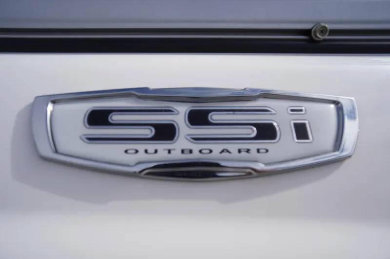Slide: The Image of 2023 Chaparral 23 SSi OB emblem, featuring sleek chrome design and "Outboard" text. - 4