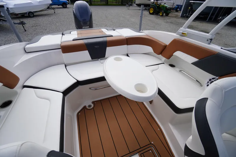 Slide: The Image of 2023 Chaparral 23 SSi OB boat interior with stylish seating and table. - 41